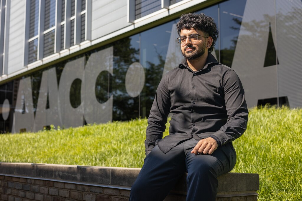 Syed Shah sits outside of Truxal Library on Anne Arundel Community College in Arnold, MD, on May 19, 2025.