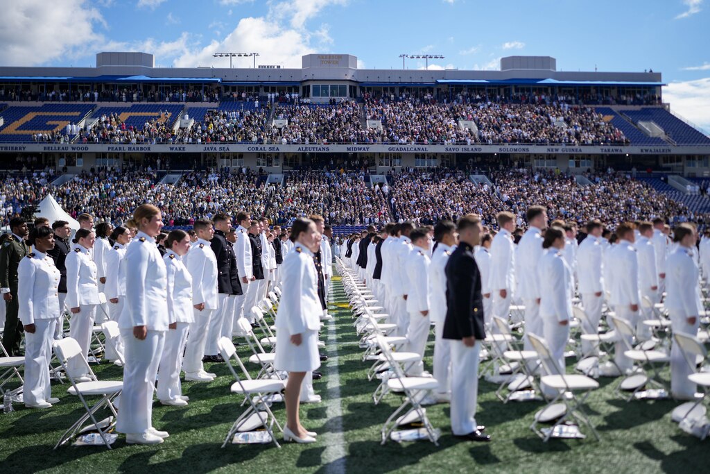 Midshipmen stand up to be recognized during the U.S. Naval Academy Class of 2025’s graduation ceremony at the Navy-Marine Corps Memorial Stadium in Annapolis, Md. on Friday, May 23, 2025.