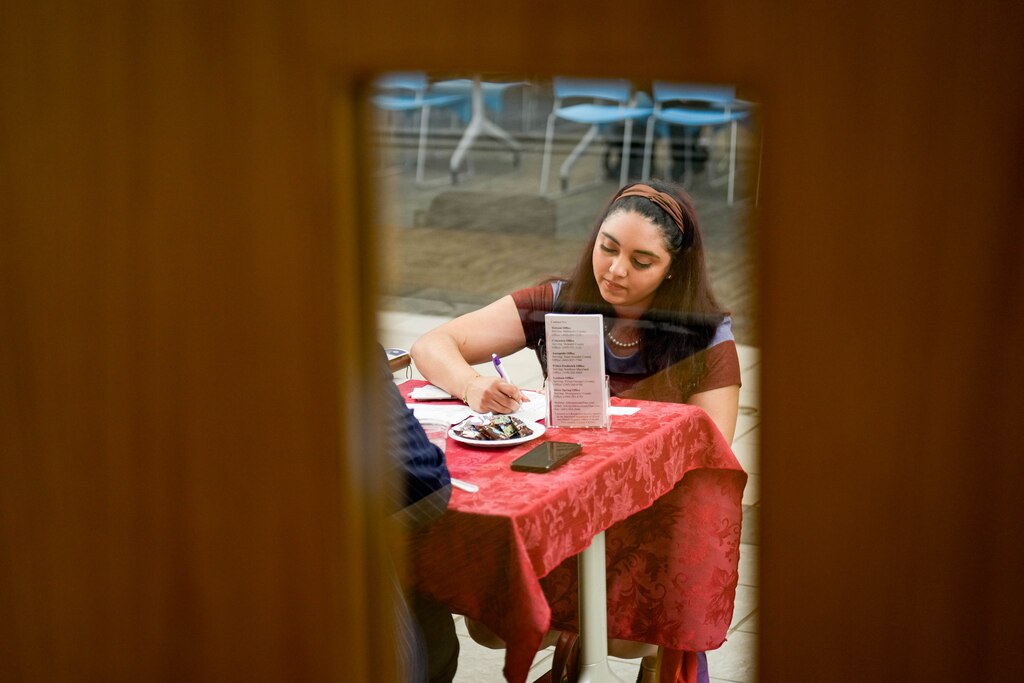 Tatyana Padro Miguel exchanges information with Davonne Ross, a representative with A Homemade Plan, during a Healthcare Employer career fair at Anne Arundel Community College in Arnold, Md. on Wednesday, May 21, 2025.