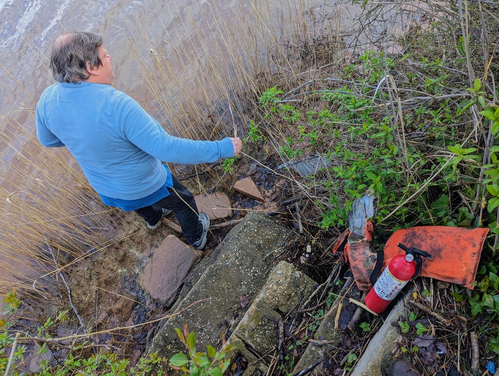 Erie Dimler is a collector of bottles and forks, buckles and do-dads. Much of it washes up on Stoney Creek, down a steep staircase to the bank below his house.
