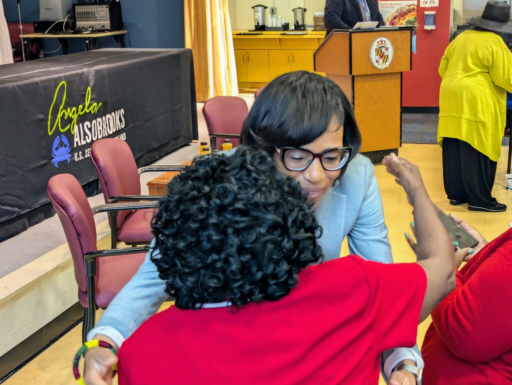 U.S. Sen. Angela Alsobrooks hugs a constituent after speaking at the Annapolis Senior Activity Center on May 28, 2025.