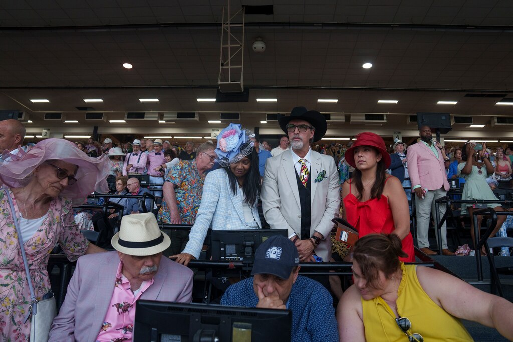 Patrons watch nervously ahead of Preakness Stakes to see if they can reap benefits from the bets they made.