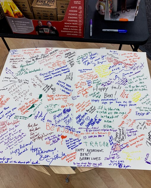 Customers and community members signed a card showing their appreciation for Benjamin at his retirement party in September 2023.