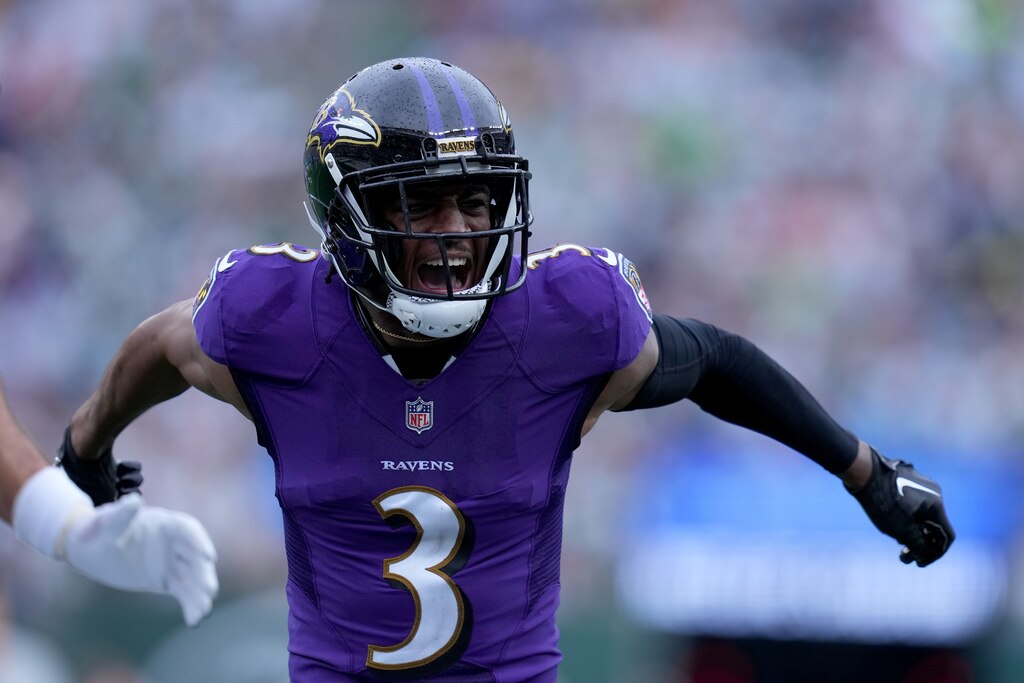 Wide Receiver James Proche II #3 of the Baltimore Ravens reacts to a touchdown scored by Wide Receiver Devin Duvernay #13 of the Baltimore Ravens during the third quarter of the game at MetLife Stadium on September 11, 2022 in East Rutherford, New Jersey.
