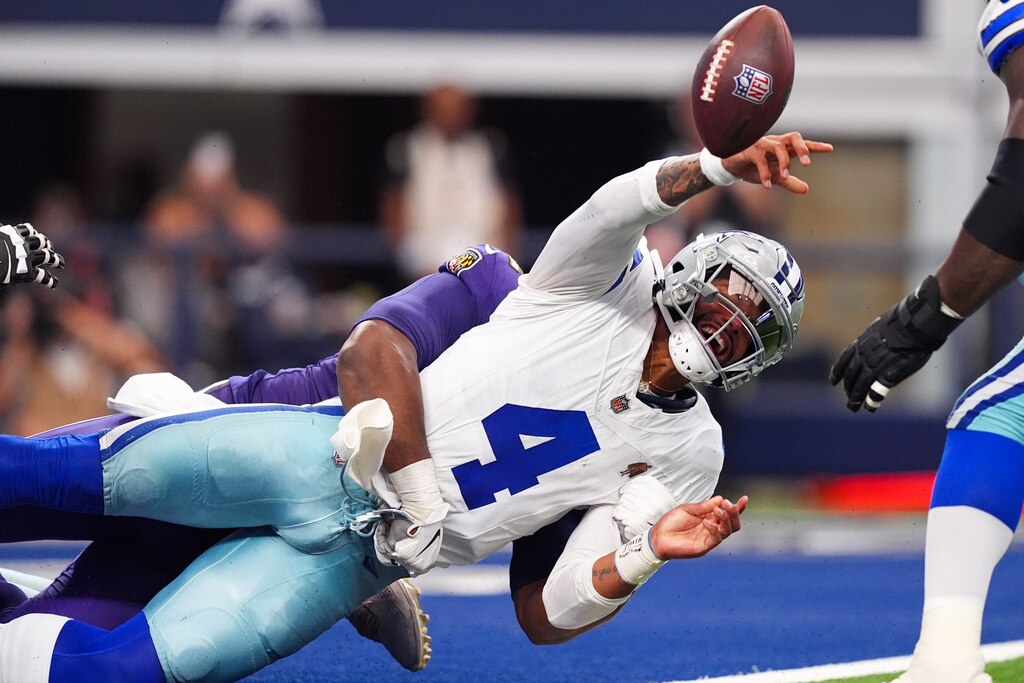 ARLINGTON, TEXAS - SEPTEMBER 22: Quarterback Dak Prescott #4 of the Dallas Cowboys attempts an illegal pass against the Baltimore Ravens during the second quarter at AT&T Stadium on September 22, 2024 in Arlington, Texas. (Photo by Sam Hodde/Getty Images)