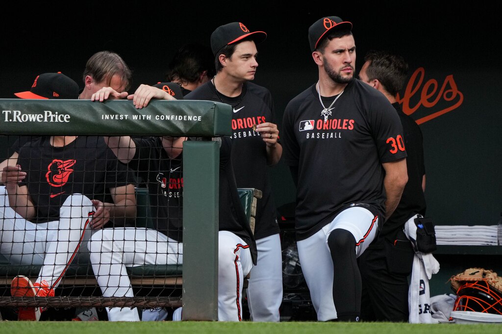 Baltimore Orioles pitcher Grayson Rodriguez, right, watches from the dugout during a game against the Detroit Tigers at Oriole Park at Camden Yards in Baltimore, Md. on Wednesday, June 11, 2025.