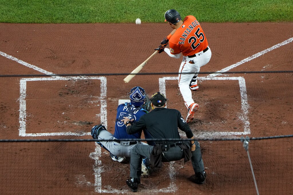 Baltimore Orioles right fielder Anthony Santander (25) swings at a pitch during a baseball game against the Tampa Bay Rays at Camden Yards on Saturday, September 16, 2023.