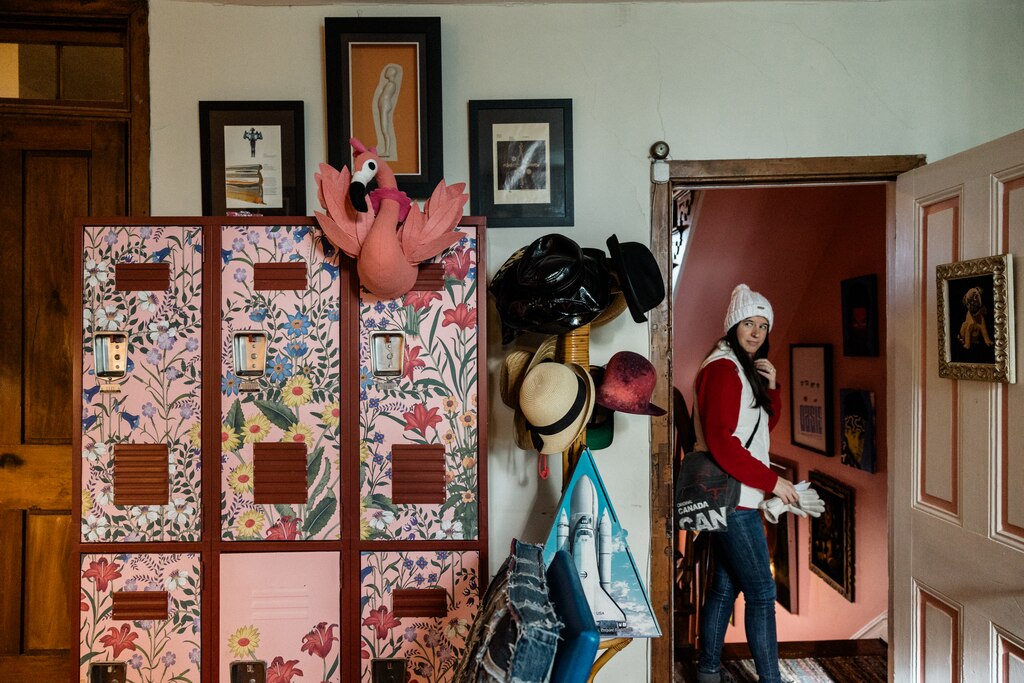 BALTIMORE, MD - DECEMBER 8, 2024: A visitor looks around the inside the home of Melinda and Joe Mele during the Annual Union Square Cookie Tour on December 8, 2024 in Baltimore, Maryland.