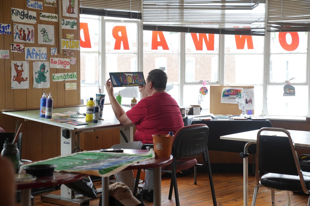 Chris Schallhorn examines an art piece he made at Make Studio in Baltimore, Md. on July 10, 2025.
