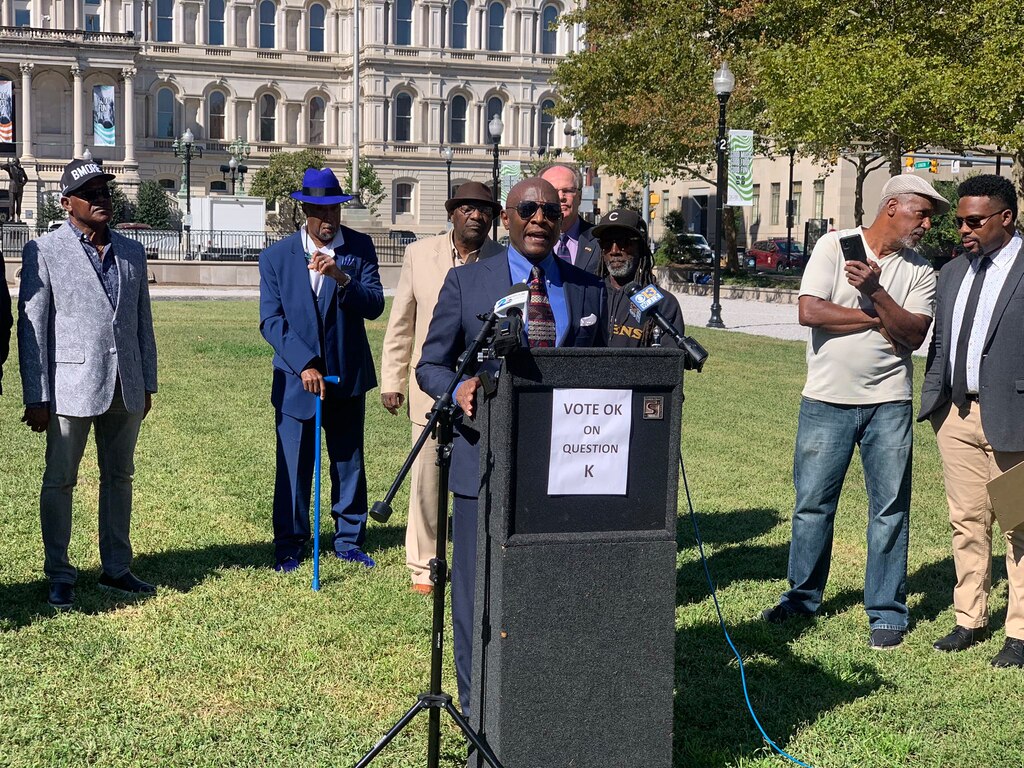 Bob Wallace speaks at a rally for 2022's ballot item Question K outside Baltimore City Hall.