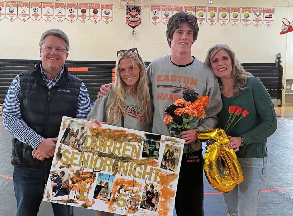 Darren Foxwell with his parents and sister.