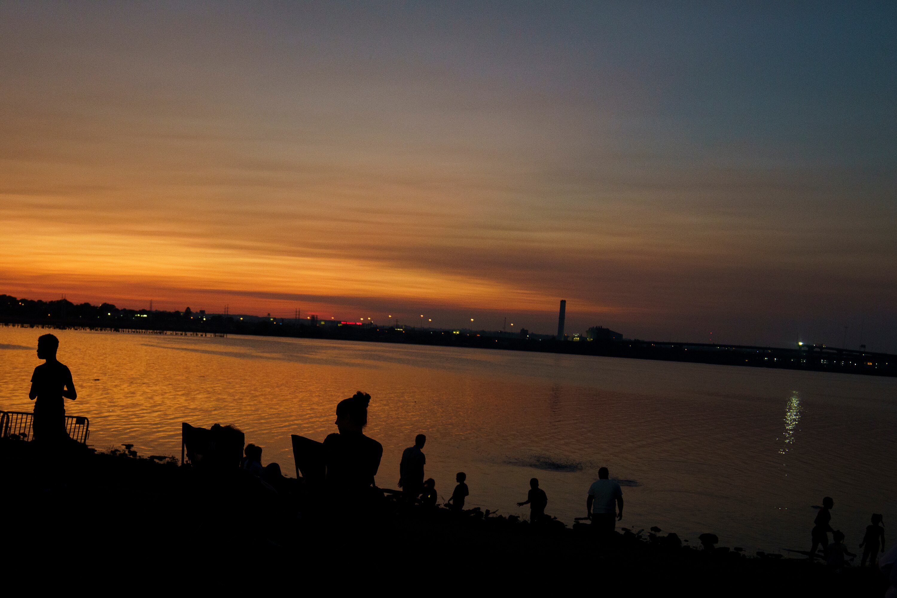 The sun sets over the Cherry Hill festival in Baltimore on July 4, 2025.