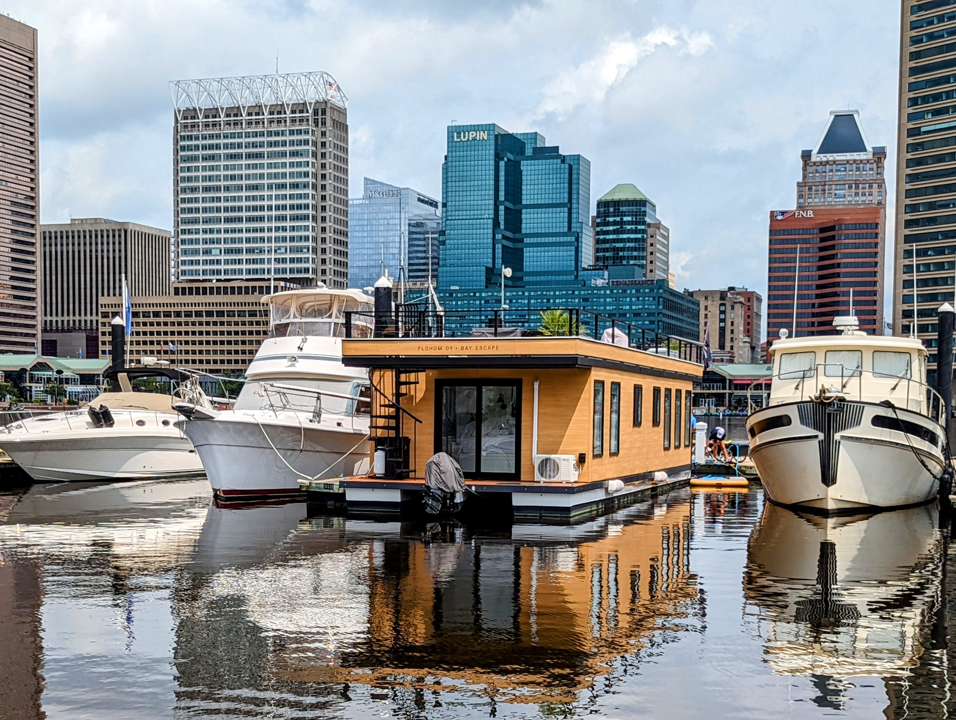 Flohom 1 Bay Escape has found a home at the Baltimore Inner Harbor marina, where it has an expensive view of the cityscape.