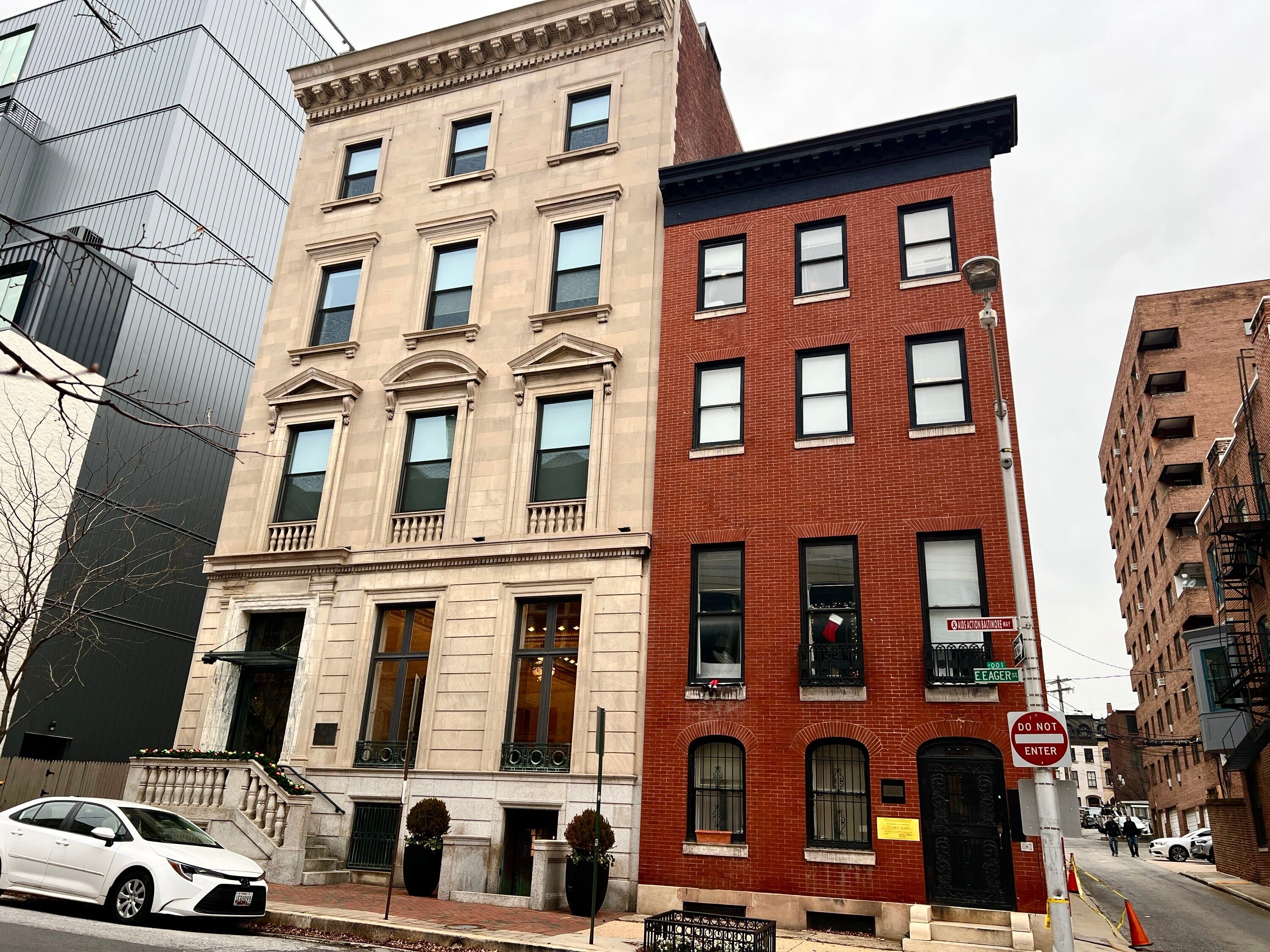 The 10-unit apartment building at 8 E. Eager St., right, in Mount Vernon was issued an emergency notice of condemnation and demolition. The building is part of the Chasen Cos. portfolio owned by real estate developer Brandon Chasen.