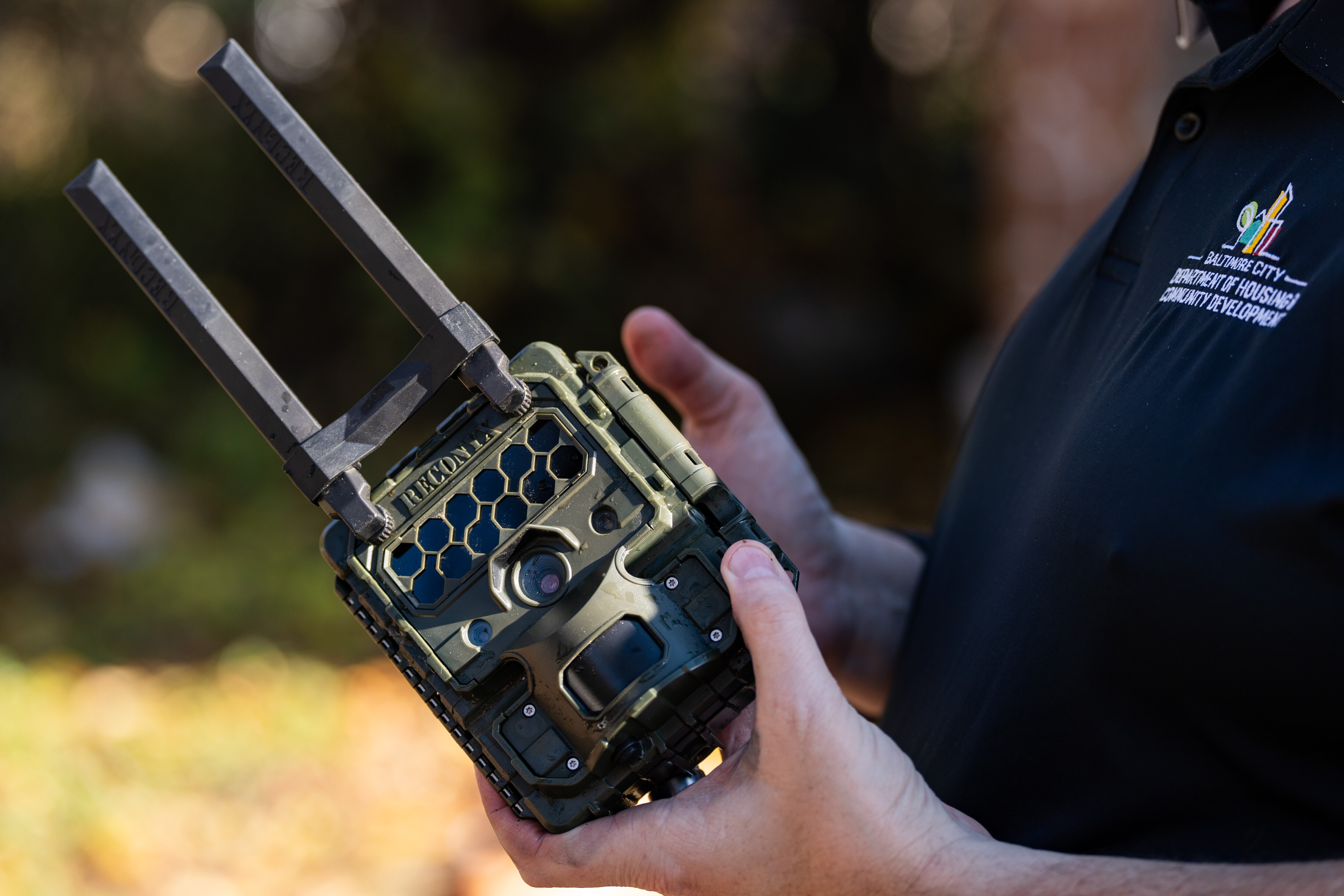 David McGinnis, director of the Department of Housing & Community Development’s Special Investigations Unit, shows one of the department’s cameras that they use to catch and convict illegal dumpers on Wednesday, Nov. 22, 2023.