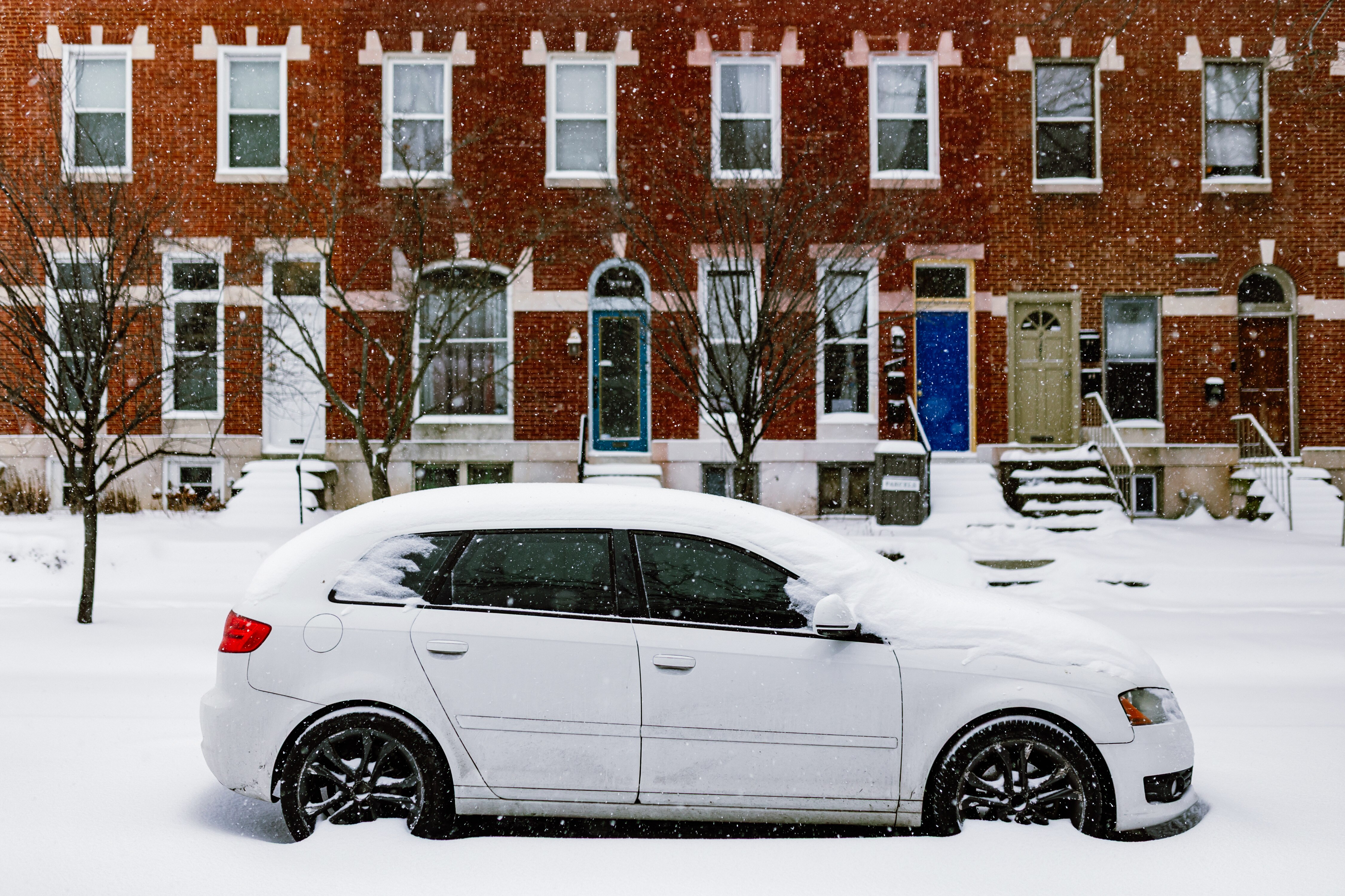A car covered in snow on Maryland Avenue in Baltimore on Sunday.