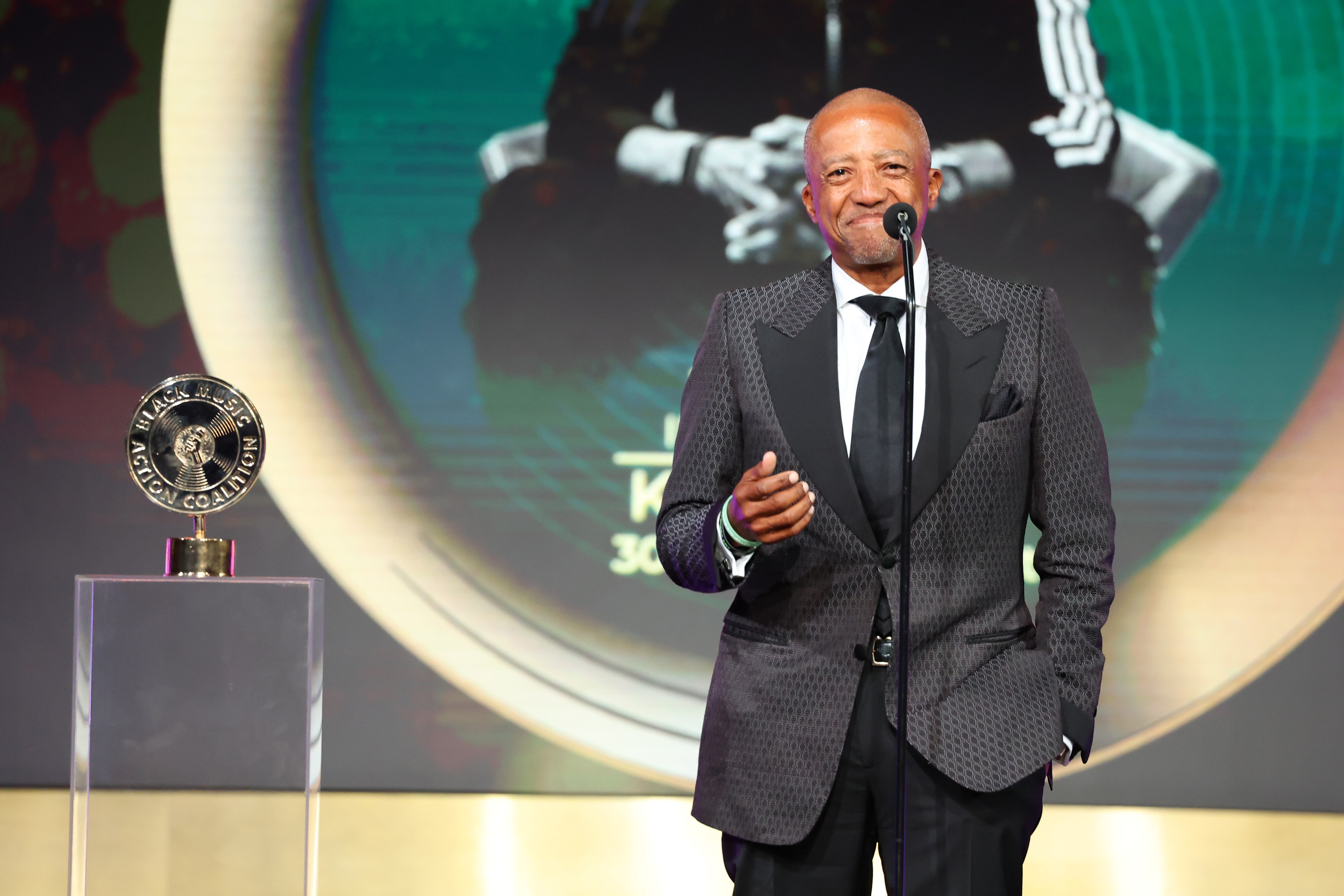 BEVERLY HILLS, CALIFORNIA - SEPTEMBER 22: Honoree, BMAC Social Impact Award Kevin Liles speaks onstage during the Black Music Action Coalition Second Annual Music in Action Awards Gala at The Beverly Hilton on September 22, 2022 in Beverly Hills, California. (Photo by Leon Bennett/Getty Images for Black Music Action Coalition )