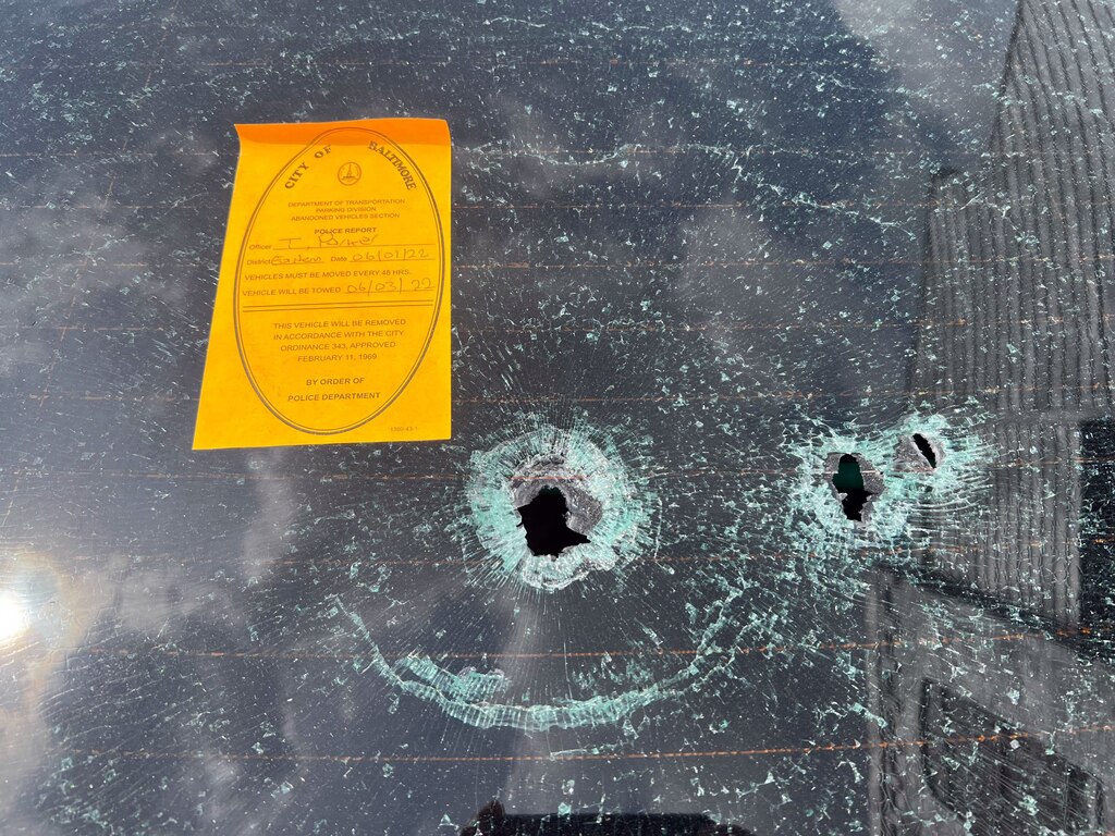 A shot-up vehicle parked in the 700 block of North Rose Street is flagged to be towed. City officials sought to flood the area with 311 requests for quality of life issues such as abandoned vehicles.