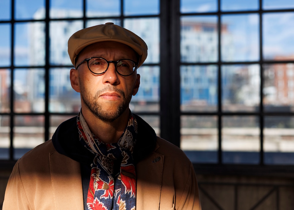 Minkah Makalani, an associate professor and director of the Center for Africana Studies at Johns Hopkins University, poses for a photo at Pennsylvania Station.