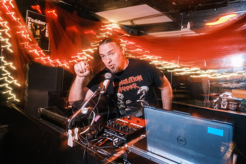 Scott Supik, Evil Scott, part of Ottobar since 2010, makes announcements at the DJ booth where he plays and takes requests for an all night Ozzy tribute on this special Metal Monday at Ottobar in Baltimore on Monday, July 28, 2025.