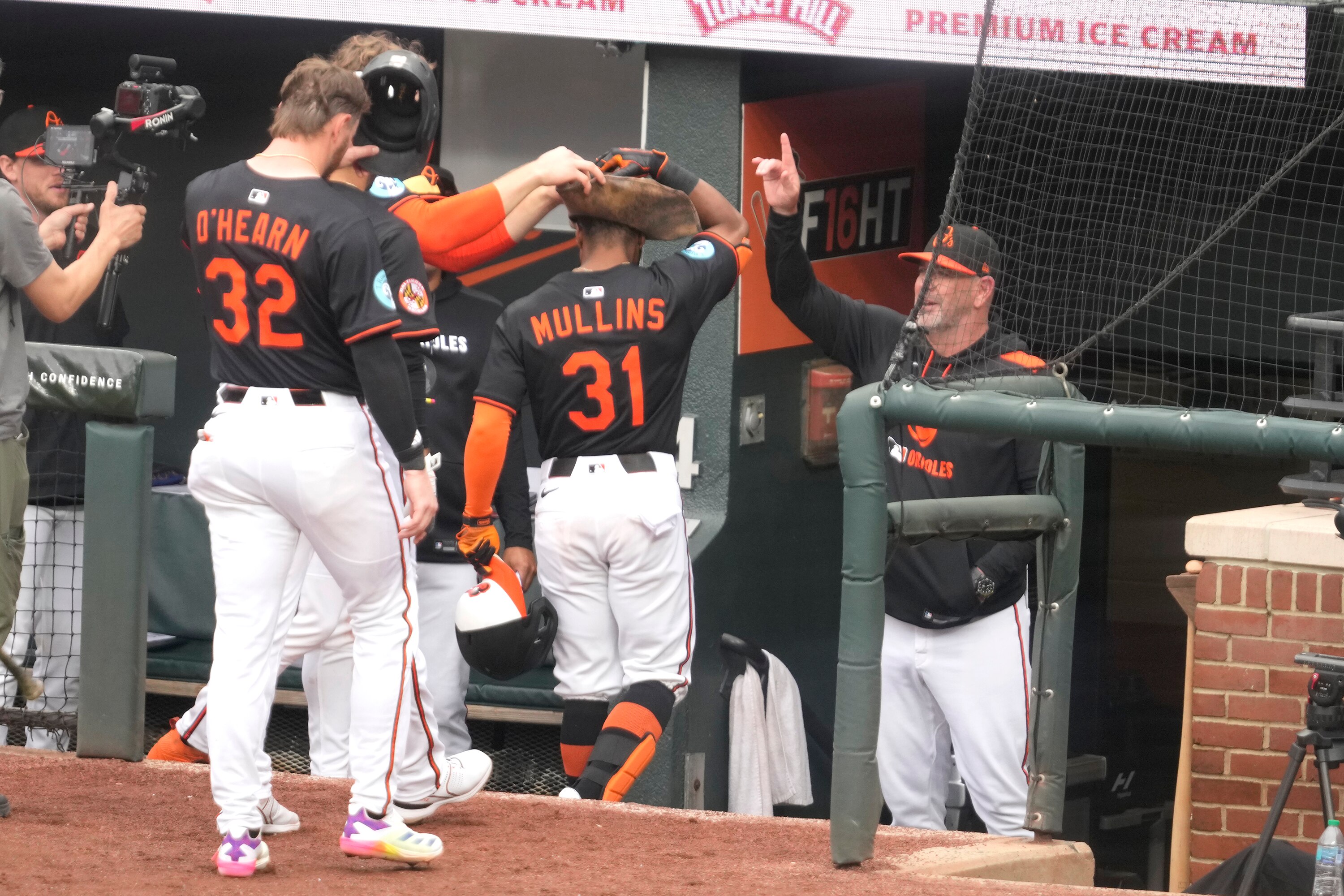 Cedric Mullins receives congratulations after a Game 2 grand slam, but the Orioles could not hold the lead in an 8-6 loss.
