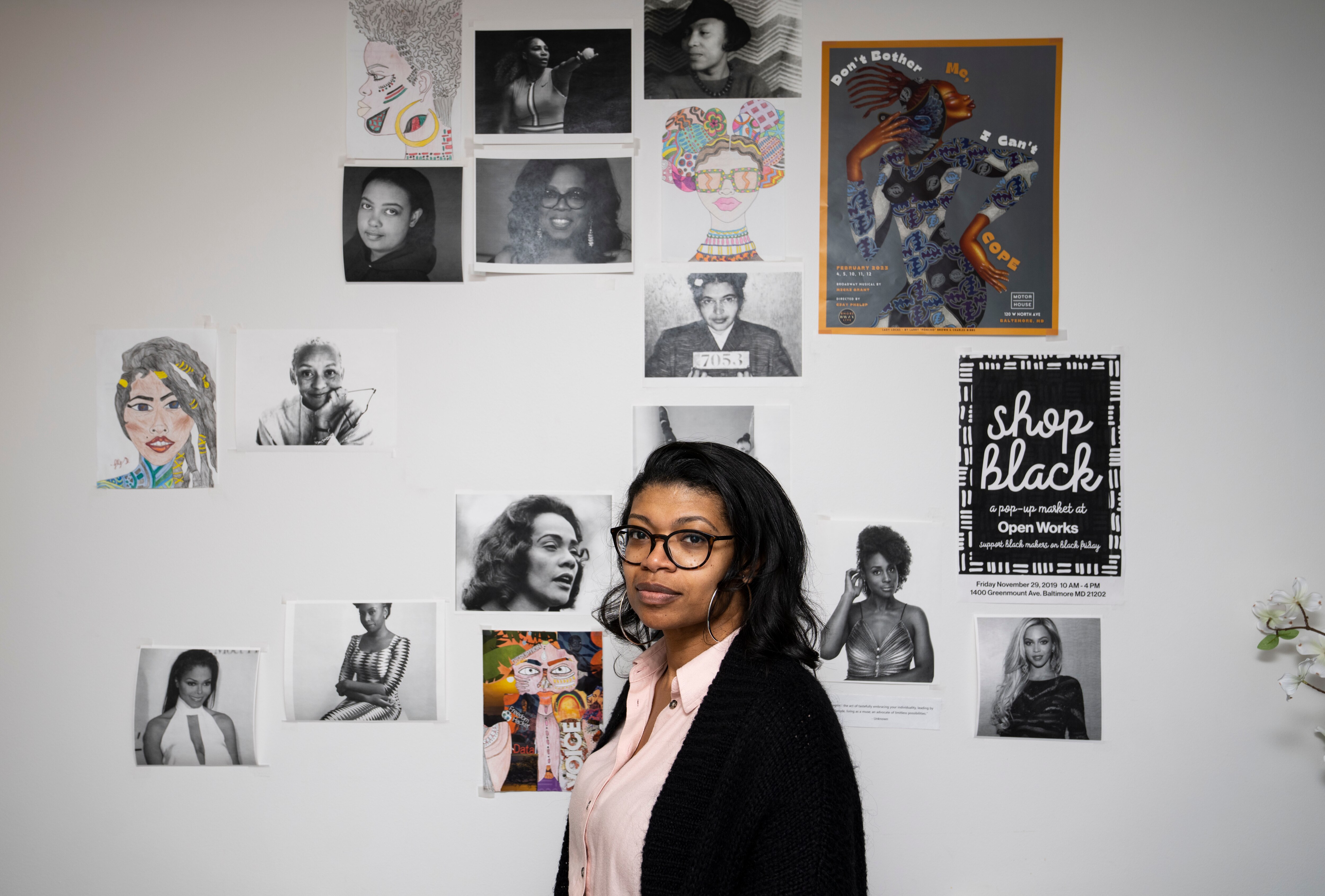 Angel St. Jean, founder and CEO of Equity Brain Trust, in front of her inspiration wall in her Baltimore office.