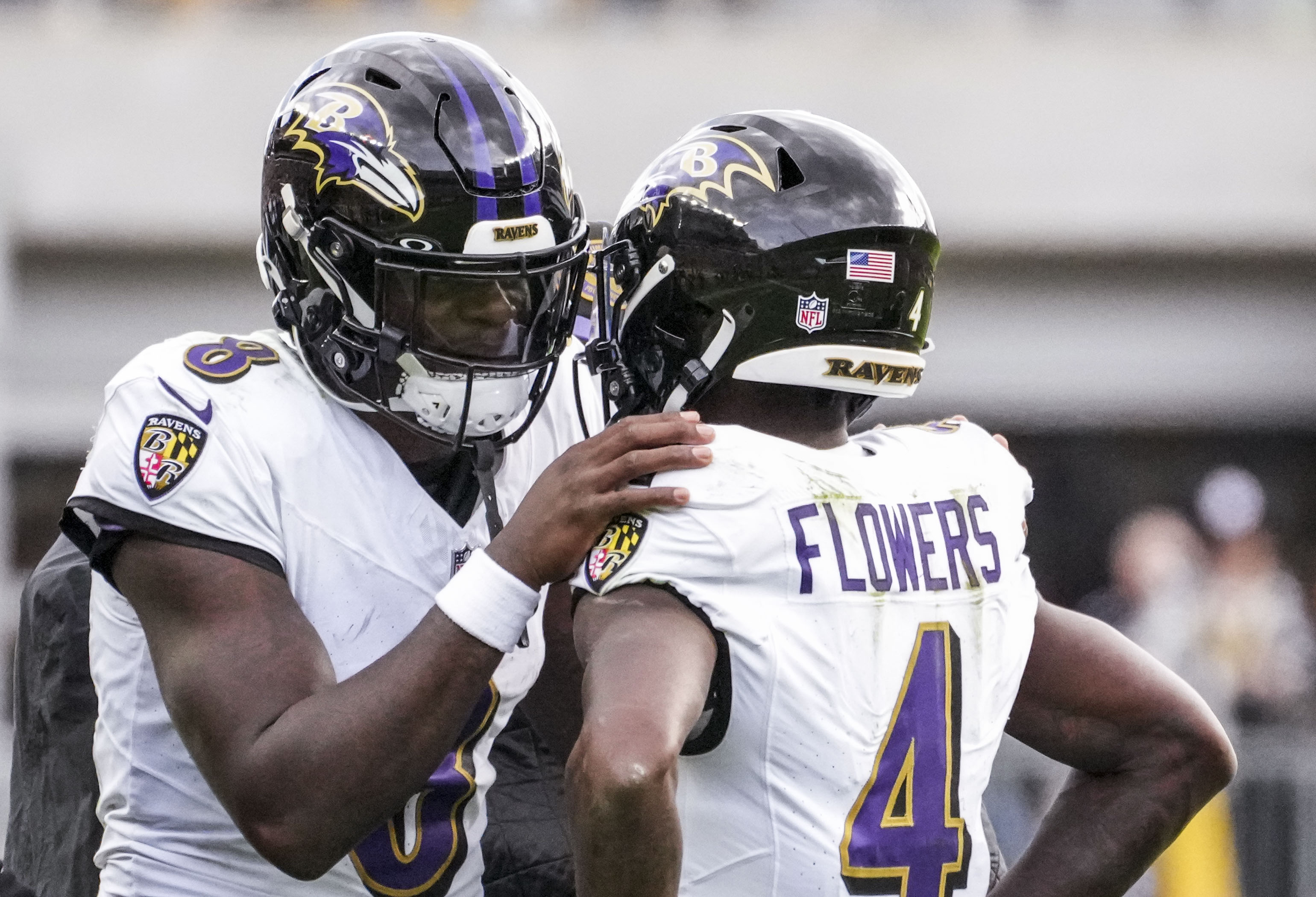 Baltimore Ravens quarterback Lamar Jackson (8) talks with Baltimore Ravens wide receiver Zay Flowers (4) while playing against the Pittsburgh Steelers at Acrisure Stadium in Pittsburgh on Sunday, Oct. 8, 2023.