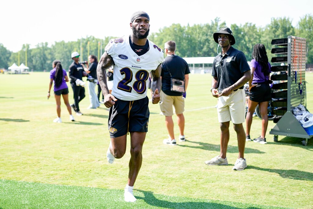 Baltimore Ravens Marquise Robinson (28) jogs back to the locker room following the team’s training camp session at the Under Armour Performance Center in Owings Mills, Md. on Thursday, July 24, 2025.