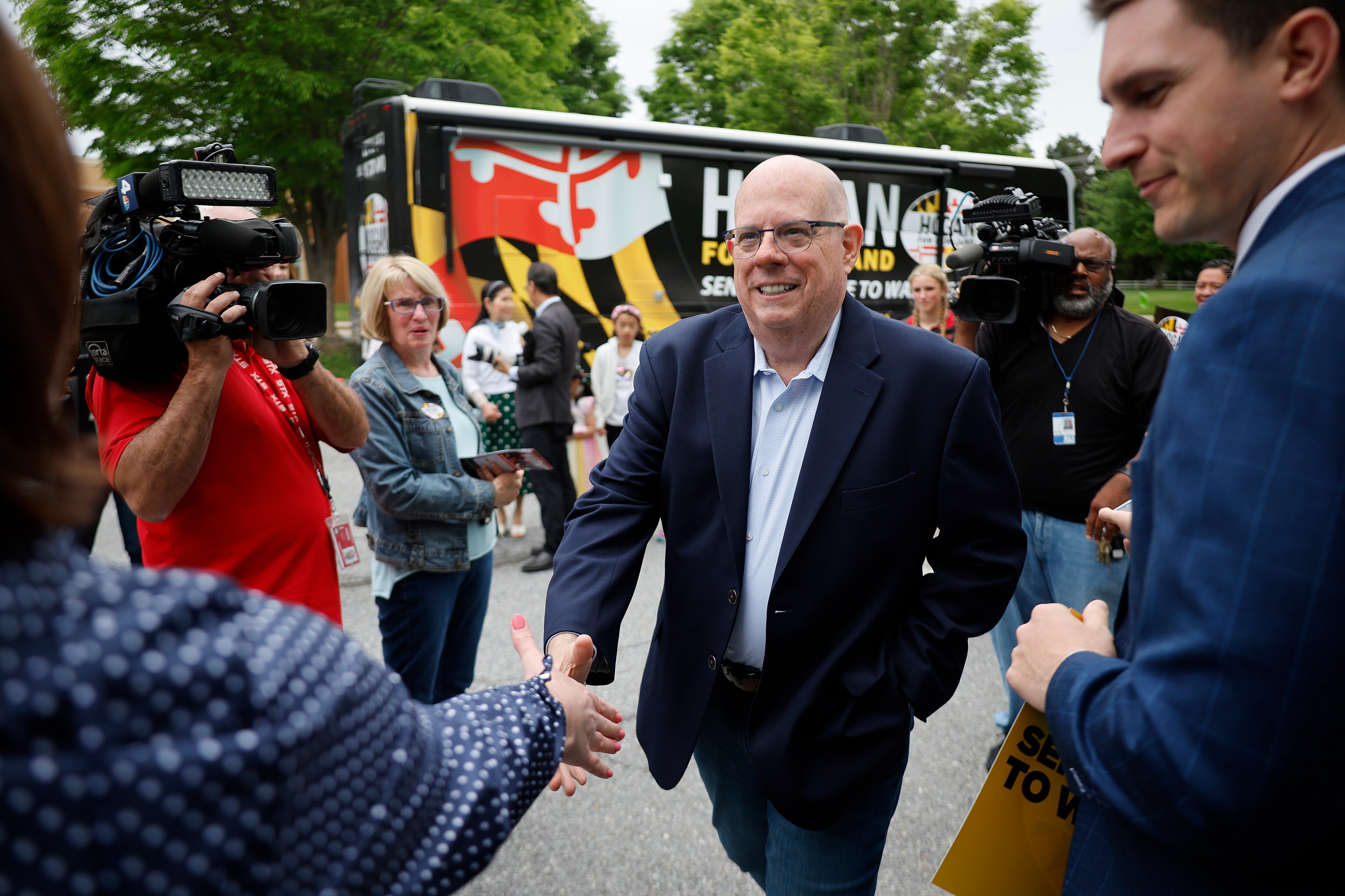 Larry Hogan greets supporters before casting his ballot in the state primary election at Davidsonville Elementary School.