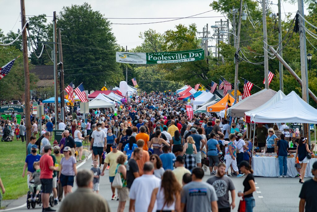 The town’s annual Poolesville Day, shown here in 2021, will take place this Saturday. In addition to taking advantage of the entertainment and food, many community members also come to rub elbows with county and state officials.