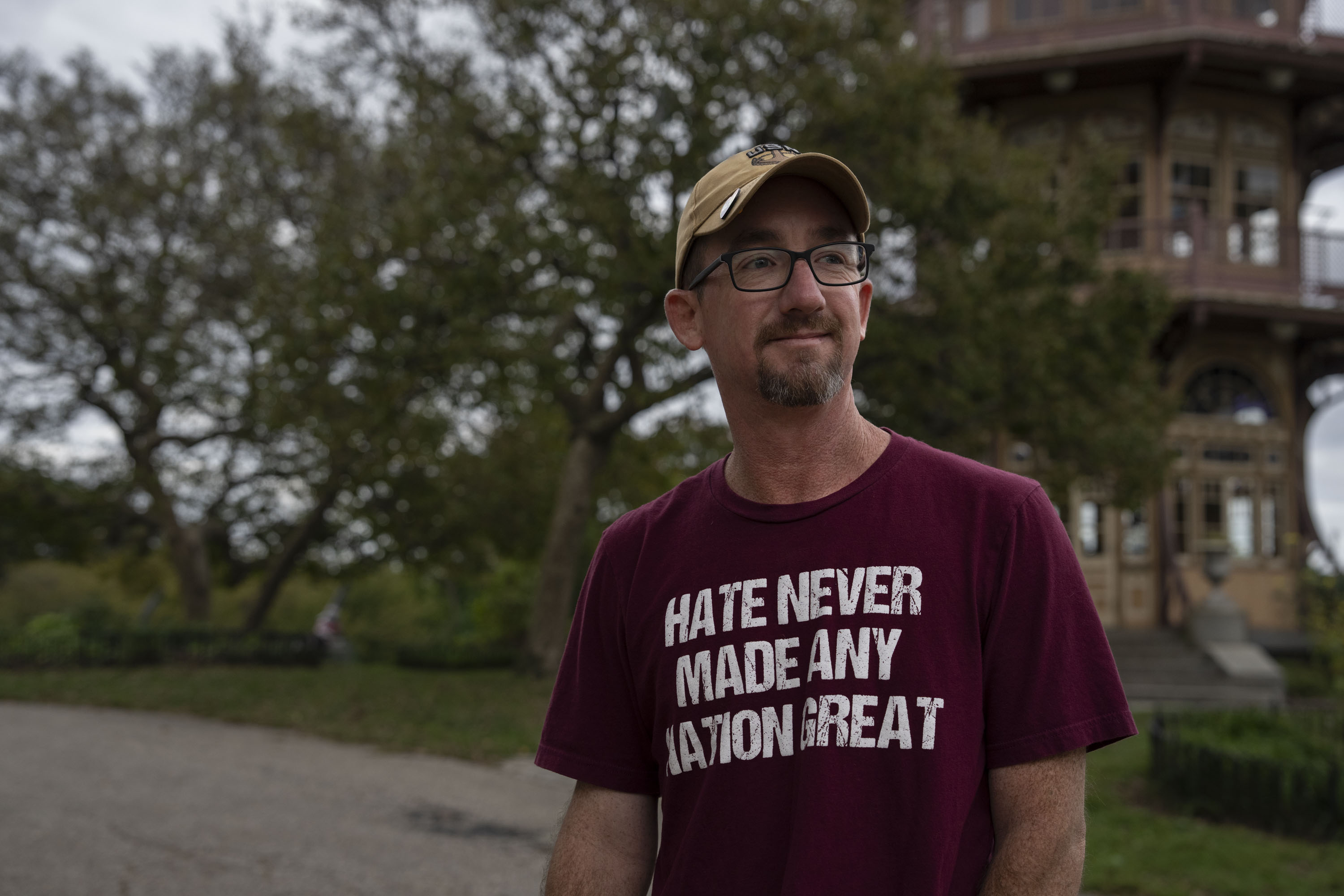 Buzz Grambo, otherwise known as the "Paul Revere of Patterson Park, walks his dog just before a storm on October 10, 2025. Grambo will often warn others when ICE is in the area.