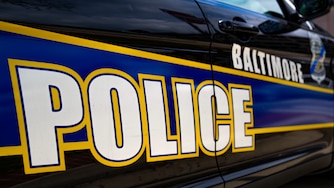 7/8/22—A Baltimore Police officer’s car is parked on the corner of E Lombard St. & President St.