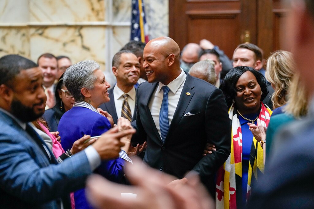 Gov. Wes Moore greets Sen. Cheryl Kagan, left, as he arrives in the House Chamber to deliver his annual State of the State address in the Maryland State House in Annapolis, Md. on Wednesday, February 5, 2025.