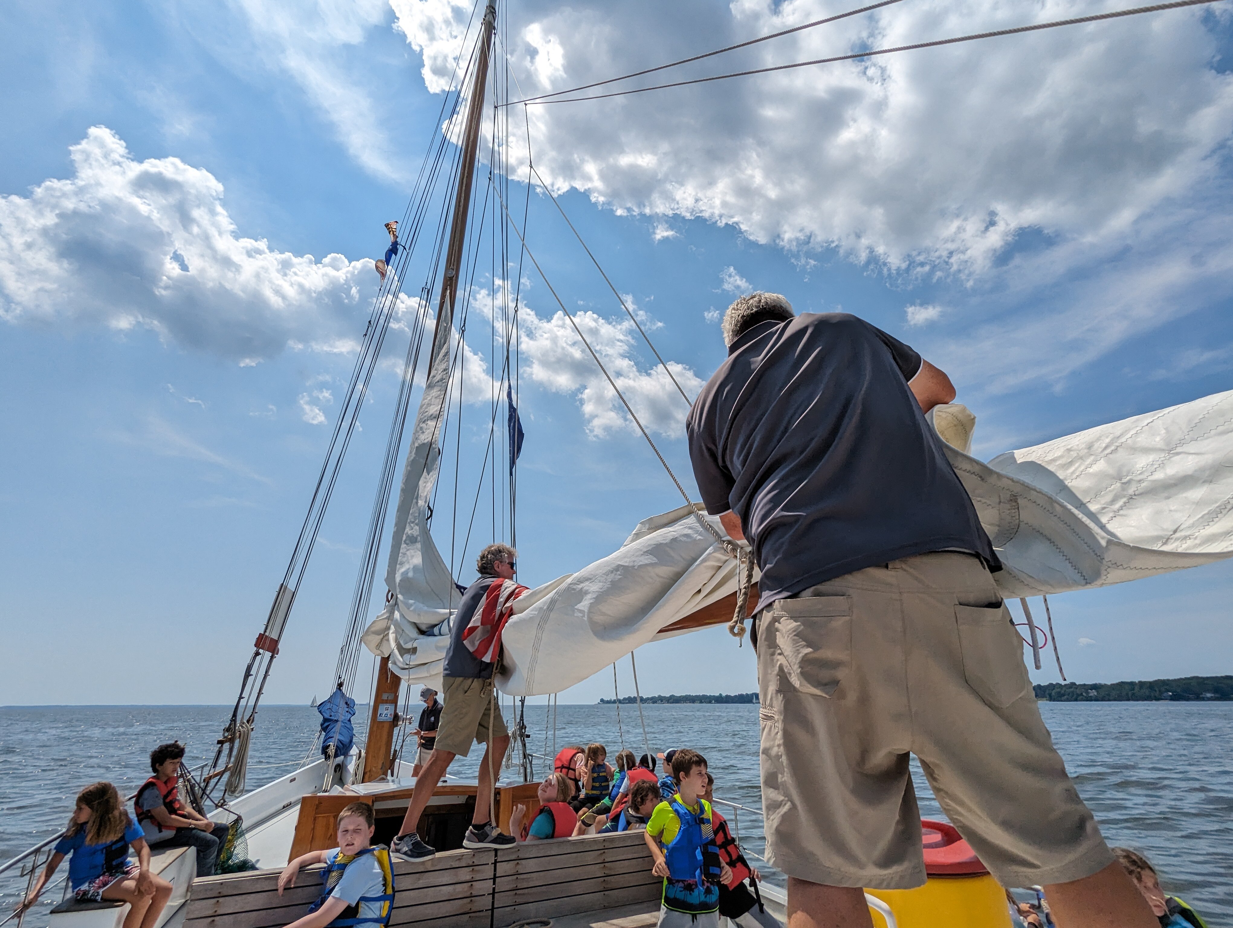 Volunteer crew Brian Fleming, left, and Philip Smith stow the mainsail aboard the Wilma Lee, an 83-year-old skipjack operated by the Annapolis Maritime Museum & Park.