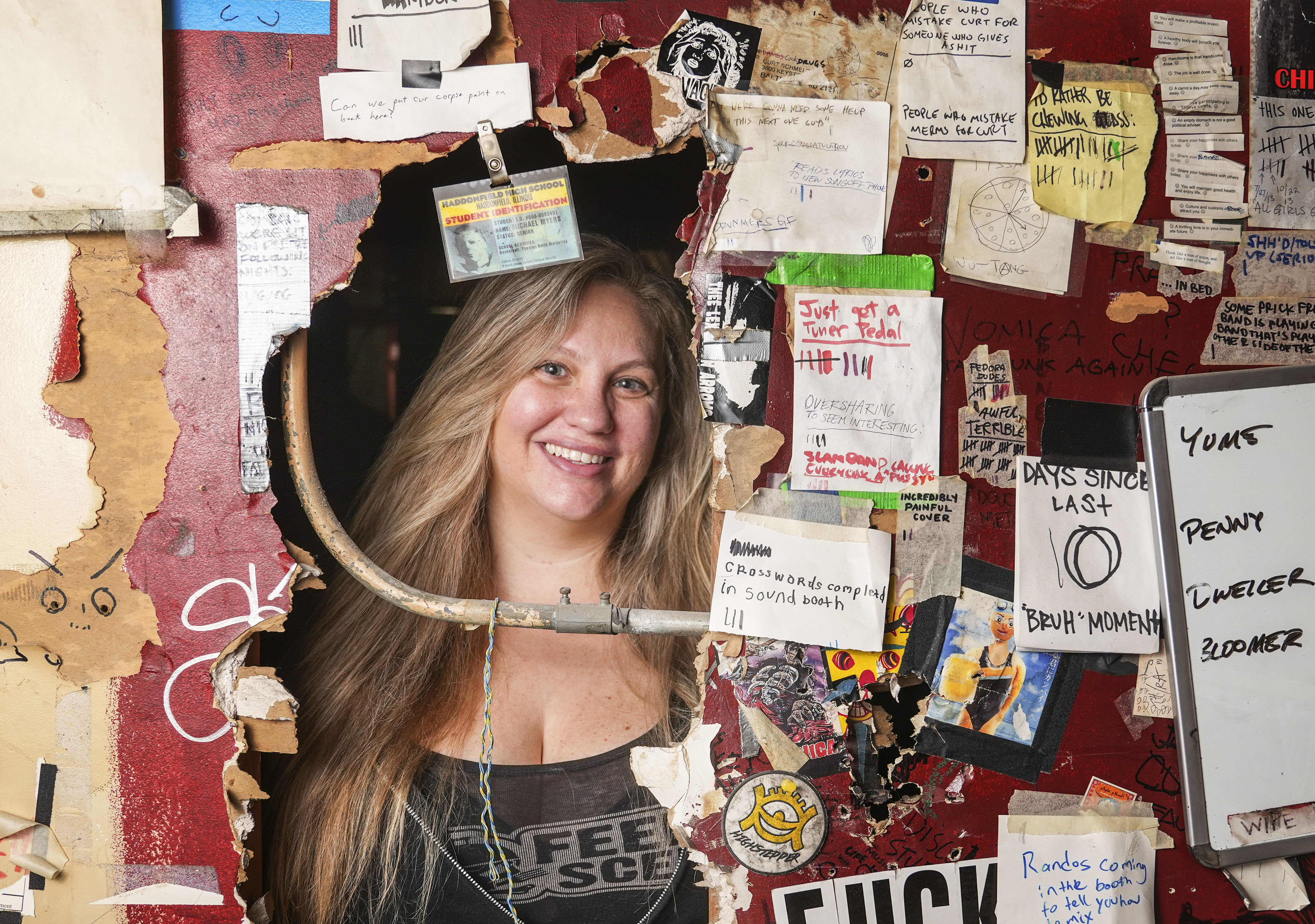 Rachel Taft, owner of The Sidebar, poses for a portrait inside the bar in Baltimore, Tuesday, May 9, 2023.