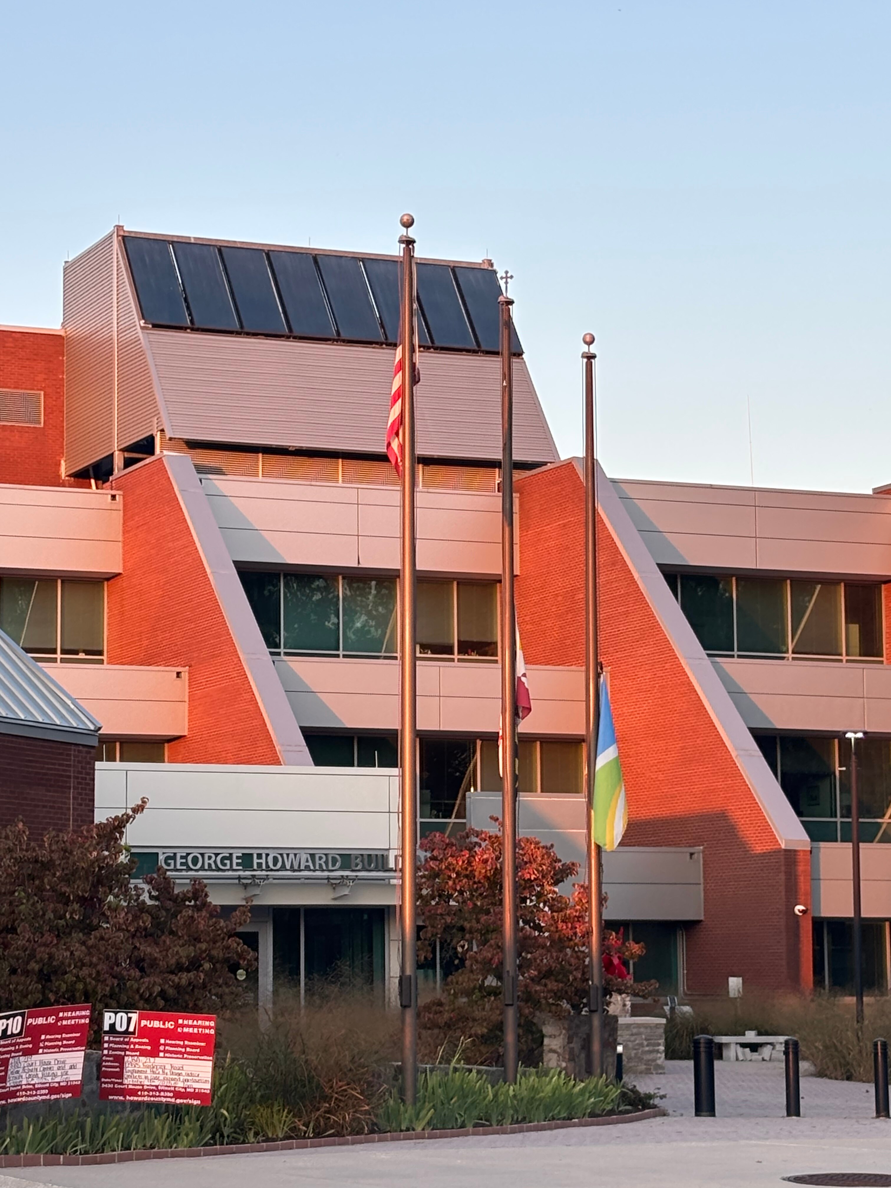 An American flag flying over the George Howard Building in Ellicott City.
