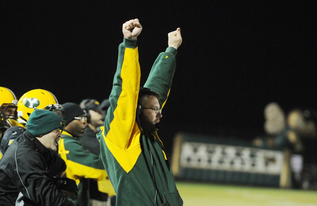 Yulee head coach Bobby Ramsay holds his hands up after a late fourth quarter interception would seal the win for his team as Yulee High School takes on Taylor County in the Region 1-4A semifinals at Yulee High School Friday night November 16, 2012. Yulee star running back Derrick Henry would go on to break the national rushing yard record of 11,232 yards from 1950-53 set by Ken Hall.