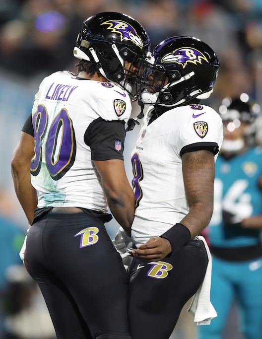 JACKSONVILLE, FLORIDA - DECEMBER 17: Isaiah Likely #80 of the Baltimore Ravens celebrates his receiving touchdown with Lamar Jackson #8 during the second quarter against the Jacksonville Jaguars at EverBank Stadium on December 17, 2023 in Jacksonville, Florida. (Photo by Mike Carlson/Getty Images)