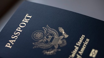 FILE - The cover of a U.S. Passport is displayed in Tigard, Ore., Saturday, Dec. 11, 2021. (AP Photo/Jenny Kane, File)