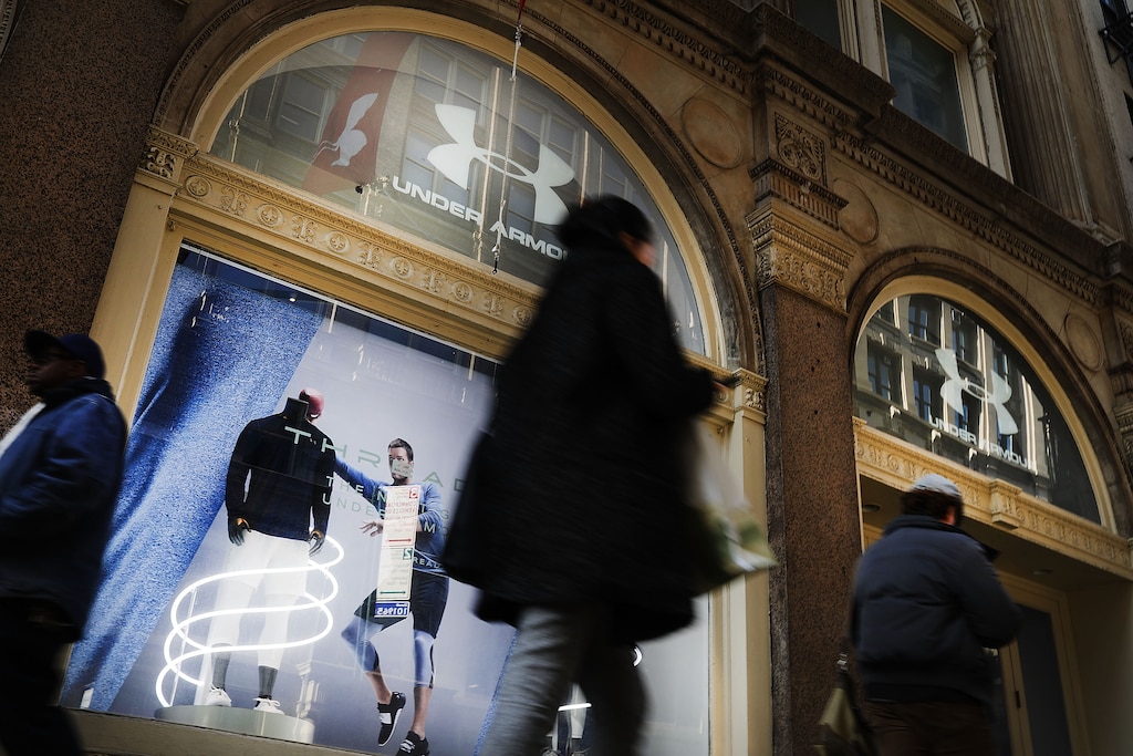 NEW YORK, NY - FEBRUARY 15: People walk by an Under Armour store in Manhattan on February 15, 2017 in New York City. Under Armour CEO and founder Kevin Plank has been trying to stem the negative publicity his company has been receiving since he publicly praised President Donald Trump. In an interview with CNBC Plank called the president a "real asset for the country" due to his pro-business stance.