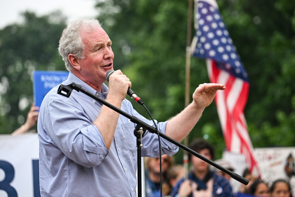 Sen. Chris Van Hollen addresses demonstrators gathered at Patterson Park in Baltimore on Saturday, June 14, 2025, for a "No Kings" protest. Dozens of similar protests were expected across the state of Maryland.