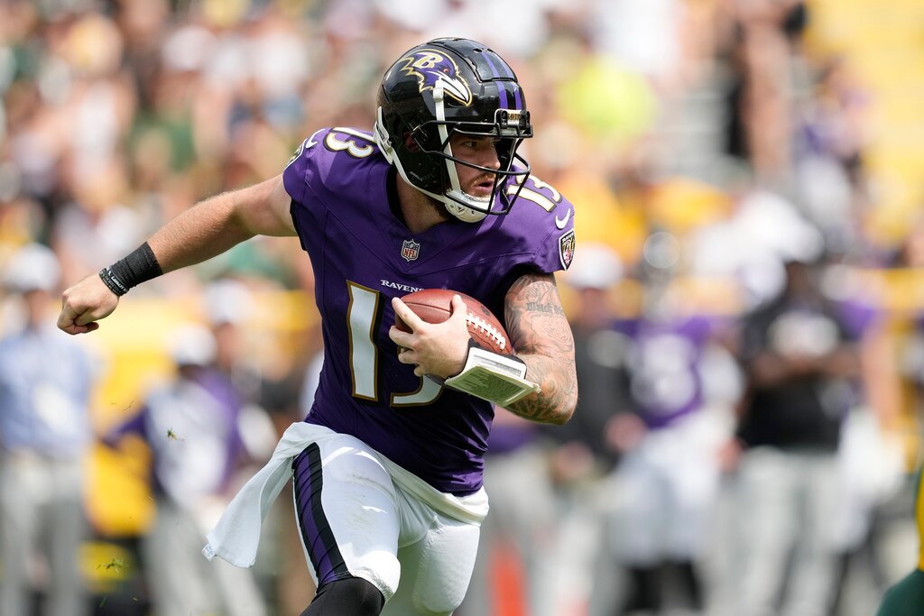 GREEN BAY, WISCONSIN - AUGUST 24: Devin Leary #13 of the Baltimore Ravens scrambles with the ball in the second half during a preseason game against the Green Bay Packers at Lambeau Field on August 24, 2024 in Green Bay, Wisconsin. (Photo by Patrick McDermott/Getty Images)