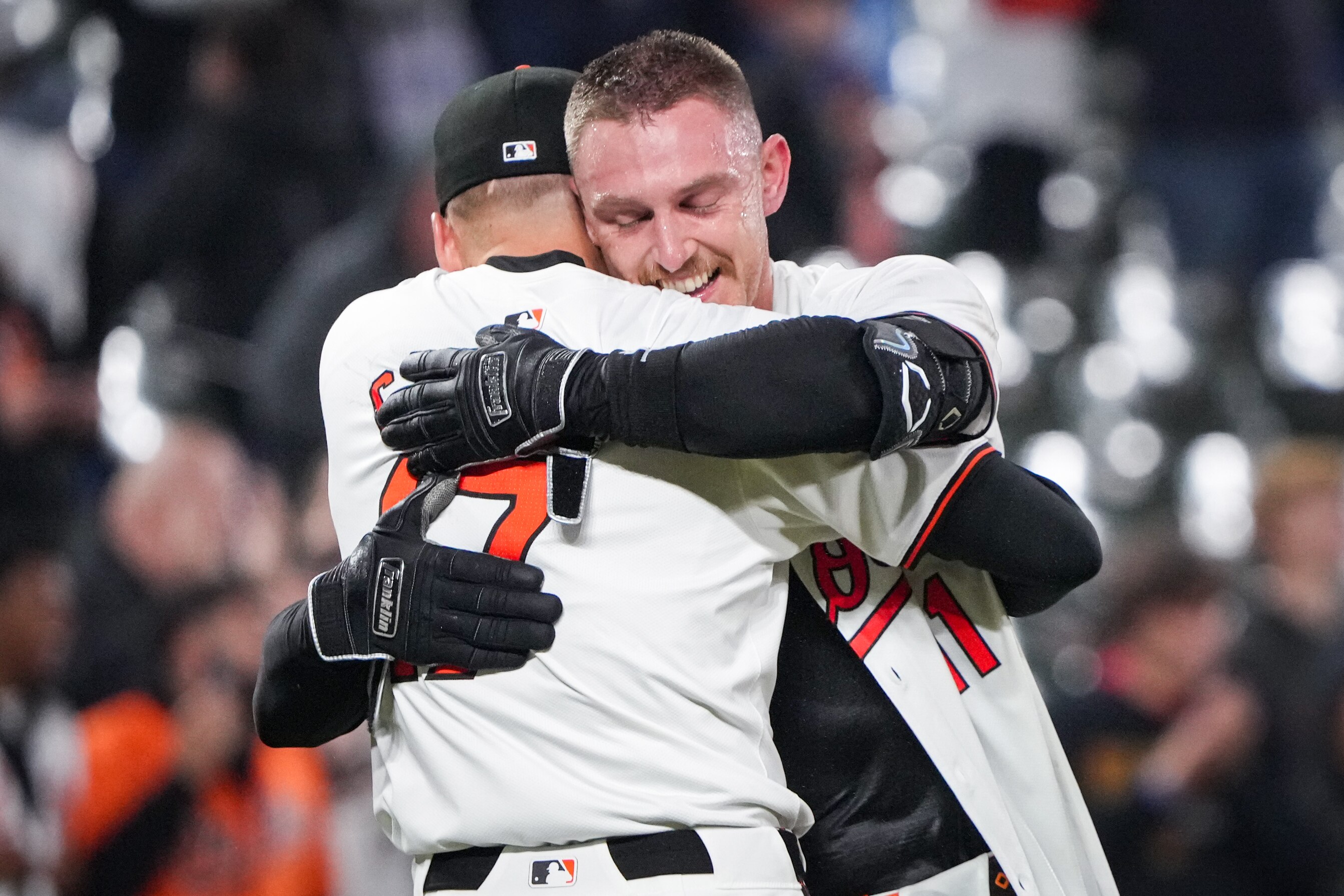 Baltimore Orioles second baseman Jordan Westburg hugs outfielder Colton Cowser (17) after hiting a two-run homer in the ninth inning for a walk-off win over the Kansas City Royals at Camden Yards on April 1, 2024.