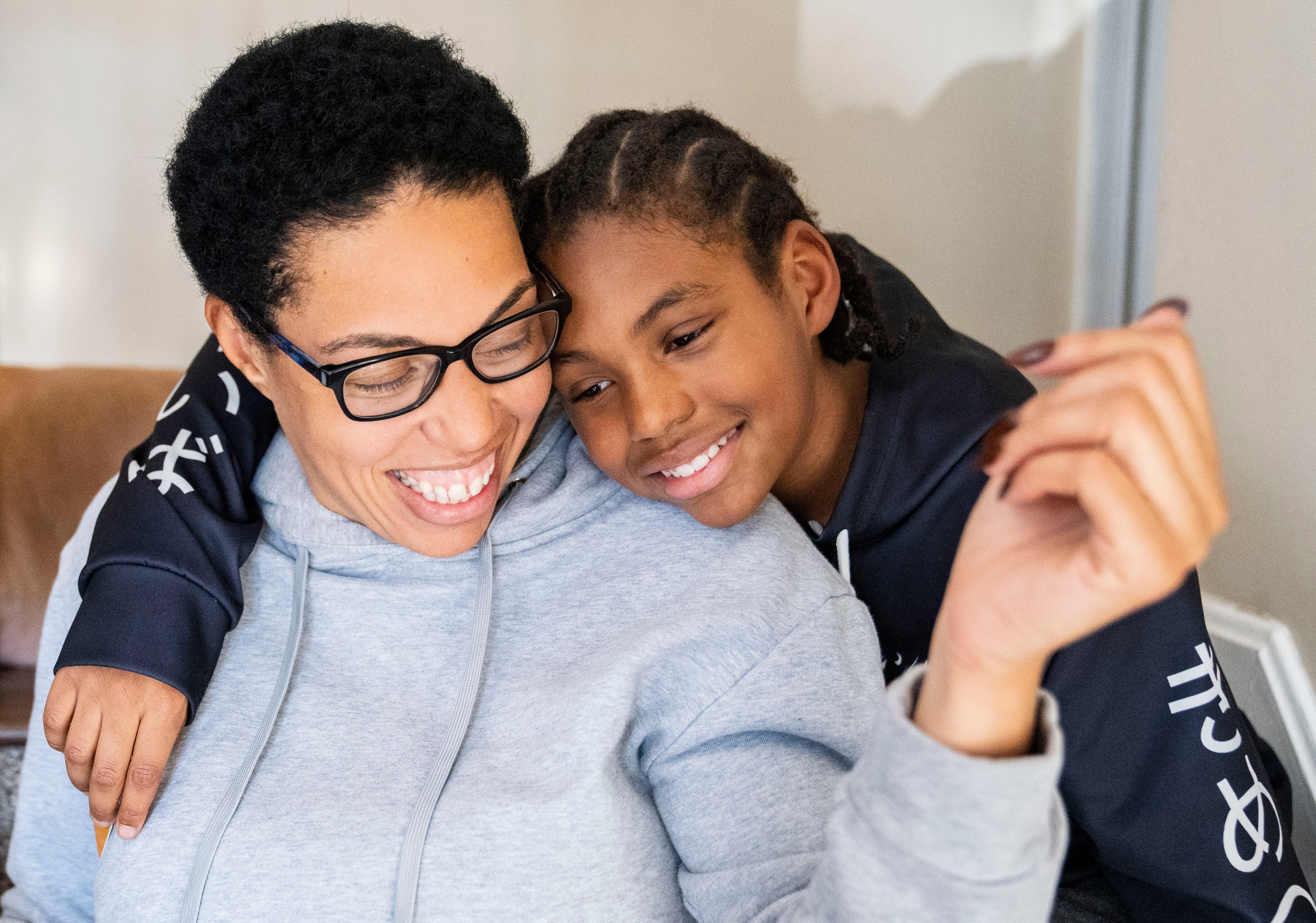 Sharnae Hunt hugs her son, Jacoby Thomas, on the steps of Hunt’s mother’s home in Glen Burnie, Sunday, December 18, 2922,