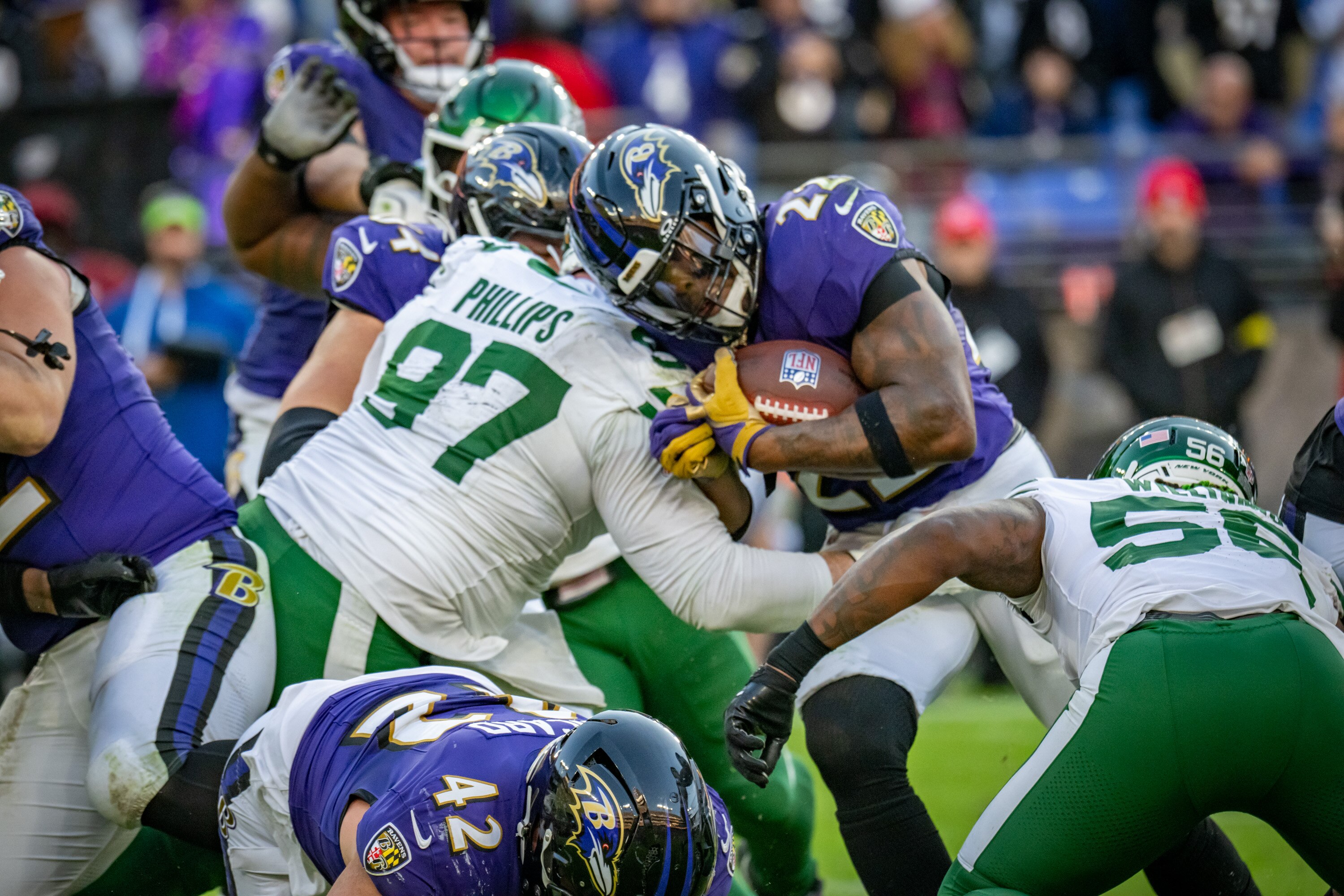 Sunday, Nov. 23, 2025 — Baltimore Ravens running back Derrick Henry (22) tries to push through the Jets defense in the 4th quarter. The Ravens beat the New York Jets 23-10 at M&T Bank Stadium.
