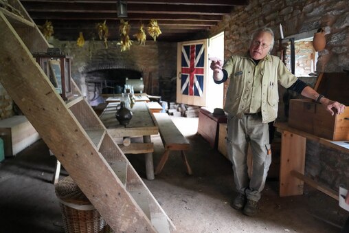 Senior Naturalist Kirk Dreier points out various aspects of the inside of Fort Garrison in Pikesville, Md. on Monday, June 16, 2025.