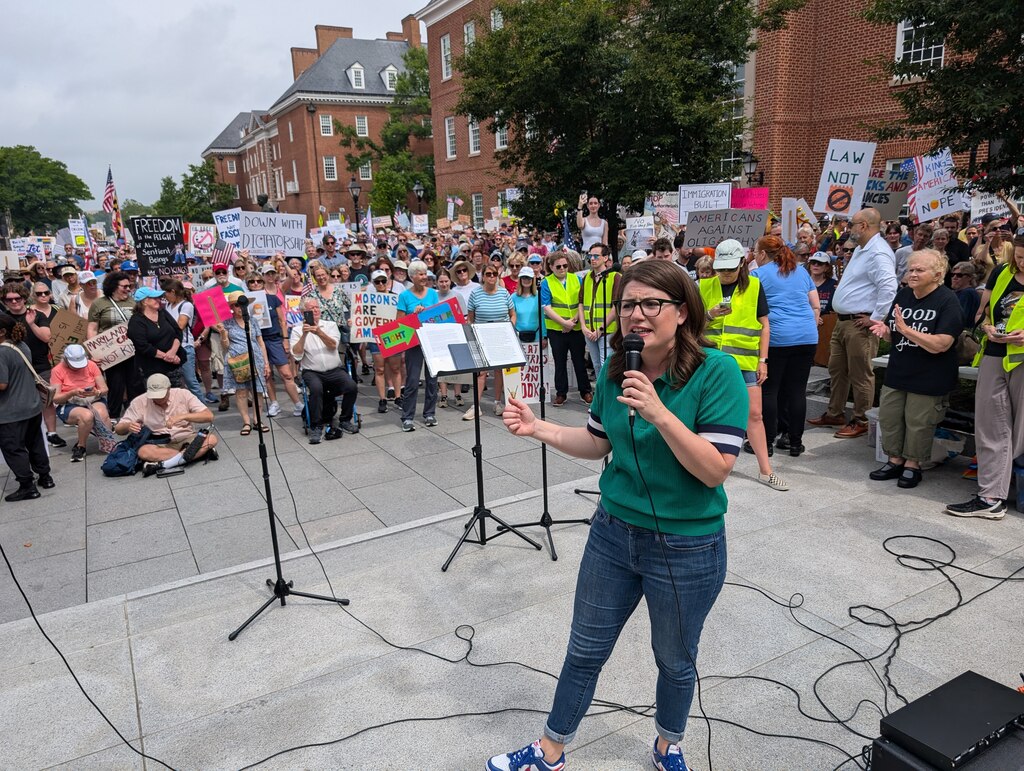 U.S. Rep. Sarah Elfreth tells the crowd at a No Kings Rally outside the State House in Annapolis on June 14, 2025 to keep their energy up for 18 months until the next election.