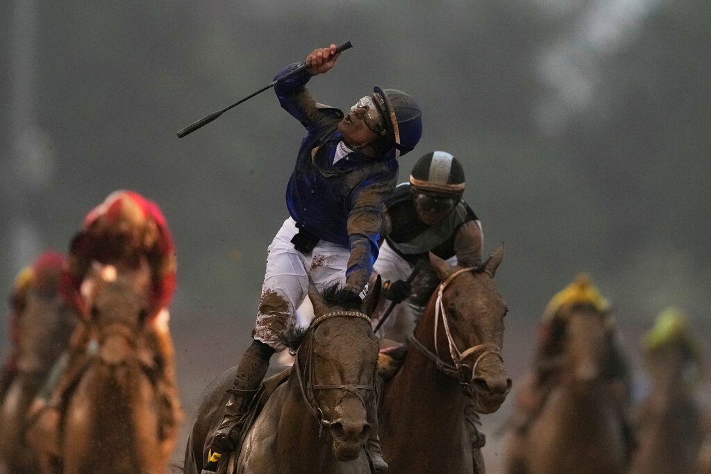Jockey Junior Alvarado celebrates after riding Sovereignty to victory in the 151st running of the Kentucky Derby horse race at Churchill Downs Saturday, May 3, 2025, in Louisville, Ky.