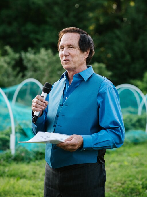 Stanton Gill speaks at the first wedding of his daughter, Kelly MacBride-Gill, in 2017.