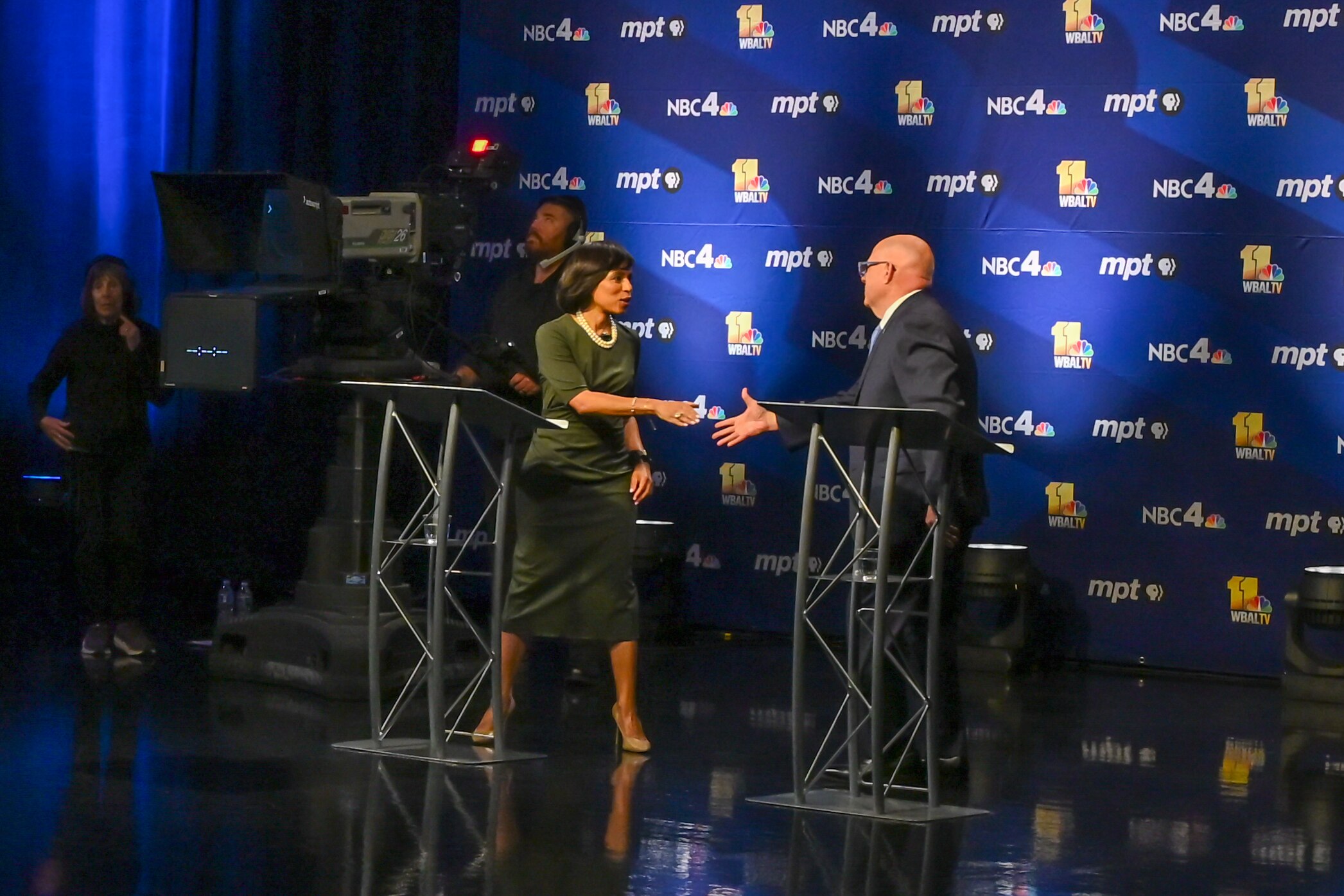 U.S. Senate candidates Angela Alsobrooks, left, and Larry Hogan, right, shake hands following the taping of a debate at the Maryland Public Television studios in Owings Mills on Thursday, Oct. 10, 2024.